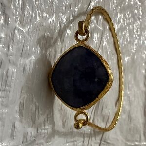 Elegant Gold Bracelet with Dark Stone